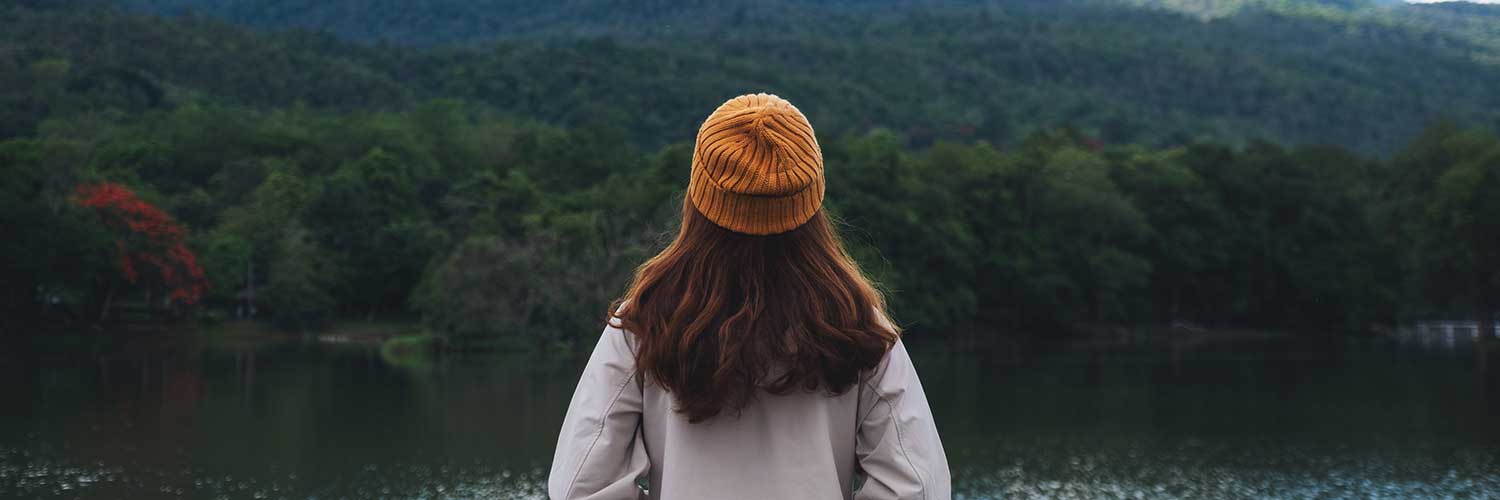 woman looking at a lake